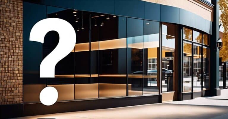 Exterior of a modern store with large reflective windows and a brick wall, featuring a large question mark, highlights the importance of Google Business Optimization for enhanced profile visibility. on possibleweb.com.